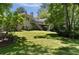 Beautiful backyard featuring a spacious deck, stairs to the lawn, and lush greenery at 1956 Regents Way, Marietta, GA 30062