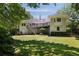 Beautiful back yard featuring a deck, mature trees and a lush green lawn at 1956 Regents Way, Marietta, GA 30062