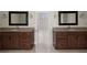 Bathroom featuring double vanity with granite countertops and dark wood cabinets at 1956 Regents Way, Marietta, GA 30062
