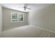 Bedroom featuring carpet, a ceiling fan, and a double-hung window to the outside at 1956 Regents Way, Marietta, GA 30062