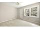 Bedroom featuring carpet, a ceiling fan, a closet, and a double-hung window at 1956 Regents Way, Marietta, GA 30062