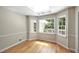 Inviting breakfast nook is surrounded by windows, creating a sunlit space for casual dining at 1956 Regents Way, Marietta, GA 30062