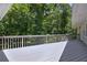 View of backyard from deck. Large deck overlooking wooded area at 1956 Regents Way, Marietta, GA 30062