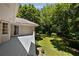 Expansive deck overlooks a lush green lawn and mature trees, perfect for outdoor entertaining and relaxation at 1956 Regents Way, Marietta, GA 30062