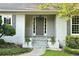 Inviting front entrance with stone steps, gray door with sidelights, and meticulously maintained landscaping at 1956 Regents Way, Marietta, GA 30062