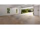 Spacious garage with an open door viewing the driveway and front yard at 1956 Regents Way, Marietta, GA 30062