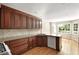 Spacious kitchen features custom wood cabinets, granite countertops, stainless appliances, and hardwood floors at 1956 Regents Way, Marietta, GA 30062