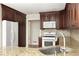 This kitchen has granite countertops, wood cabinets, stainless steel appliances, and a tile backsplash at 1956 Regents Way, Marietta, GA 30062