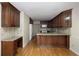 Well-appointed kitchen features granite countertops, hardwood floors, and ample storage at 1956 Regents Way, Marietta, GA 30062