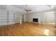 Comfortable living room with hardwood floors, built-in shelves, and a cozy fireplace at 1956 Regents Way, Marietta, GA 30062