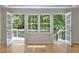 Bright room with hardwood floors and French doors that open to a scenic patio at 1956 Regents Way, Marietta, GA 30062