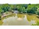 Aerial view of the pond with fountain, pool, and surrounding lush green landscape at 4177 Elder Ln, Duluth, GA 30096