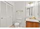 Cozy bathroom featuring white beadboard walls and a wood vanity at 4177 Elder Ln, Duluth, GA 30096