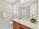 Bright bathroom featuring a large mirror, vanity, and decorative lighting at 4177 Elder Ln, Duluth, GA 30096
