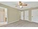 Bedroom featuring carpet floors, a ceiling fan, and access to the bathroom and closets at 4177 Elder Ln, Duluth, GA 30096