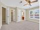 Large bedroom featuring lots of natural light, a ceiling fan, and easy access to a full bathroom at 4177 Elder Ln, Duluth, GA 30096