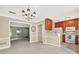 Dining area open to the kitchen featuring tile floors, white appliances, and views into the living room at 4177 Elder Ln, Duluth, GA 30096