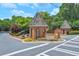 Welcoming community entrance featuring brick architecture, lush landscaping, and signage at 4177 Elder Ln, Duluth, GA 30096