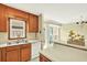 Open kitchen featuring wooden cabinets, light countertops, and an adjacent dining area at 4177 Elder Ln, Duluth, GA 30096
