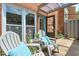 Charming patio with seating, pillows, and plants, perfect for relaxing outdoors at 4177 Elder Ln, Duluth, GA 30096