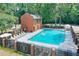 Community swimming pool with lounge chairs and shade umbrellas for relaxation at 4177 Elder Ln, Duluth, GA 30096
