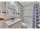 Well-lit bathroom featuring shower/tub combo, grab bar, and neutral decor at 849 N Park Ave, Marietta, GA 30060