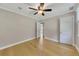 Bright bedroom with hardwood floors, a ceiling fan, and two closets for ample storage at 849 N Park Ave, Marietta, GA 30060