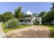 Exterior shot of home showing the front porch and gravel driveway at 849 N Park Ave, Marietta, GA 30060