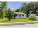 Charming one-story home with a front porch and well-maintained lawn surrounded by mature trees at 849 N Park Ave, Marietta, GA 30060