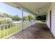 Inviting covered front porch featuring a wooden floor and a ceiling fan, perfect for outdoor enjoyment at 849 N Park Ave, Marietta, GA 30060