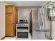 The kitchen features stainless steel appliances, a gas stove, and wooden cabinets at 849 N Park Ave, Marietta, GA 30060