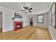 Living room showing fireplace, windows, hardwood floors and access to other rooms at 849 N Park Ave, Marietta, GA 30060