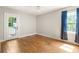Empty bedroom with hardwood floors, natural light, and private entrance at 2732 Arbor Se Ave, Atlanta, GA 30317