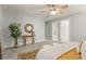Relaxing primary bedroom featuring light gray walls, ceiling fan, and stylish decor at 2732 Arbor Se Ave, Atlanta, GA 30317