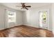 Bright, empty bedroom with hardwood floors, natural light, and a door leading to the deck at 2732 Arbor Se Ave, Atlanta, GA 30317