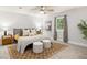 Bright primary bedroom offers a tranquil retreat with plush carpet, stylish decor, and natural light at 2732 Arbor Se Ave, Atlanta, GA 30317