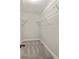 Walk-in closet with white wire shelving provides optimal organization at 2732 Arbor Se Ave, Atlanta, GA 30317