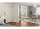 Charming dining area with hardwood floors, bright lighting, and easy access to the front door at 2732 Arbor Se Ave, Atlanta, GA 30317