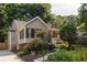 Charming home with landscaped front yard, a screened porch, and stone pathway at 2732 Arbor Se Ave, Atlanta, GA 30317