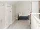 Cozy upstairs hallway seating area with bench, storage, and natural light at 2732 Arbor Se Ave, Atlanta, GA 30317