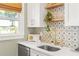 Well-appointed kitchen featuring modern appliances, stylish backsplash, and a bright, open layout at 2732 Arbor Se Ave, Atlanta, GA 30317