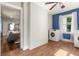 Laundry area with modern washer and dryer, wood-look floors, next to dining and living area at 2732 Arbor Se Ave, Atlanta, GA 30317