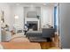 Stylish living room with a decorative fireplace, hardwood floors, and elegant furnishings with lots of natural light at 2732 Arbor Se Ave, Atlanta, GA 30317
