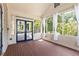 Bright screened porch with wood floors and plenty of natural light with access to the rear of the property at 2732 Arbor Se Ave, Atlanta, GA 30317