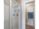 Glass enclosed shower with tile surround, adjacent to an open doorway to the toilet at 4206 Mastic Pt # 24, Acworth, GA 30101