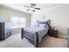 Comfortable bedroom with neutral decor, ceiling fan, and large window at 4206 Mastic Pt # 24, Acworth, GA 30101