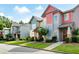 Street view of townhouses showcasing colorful exteriors, landscaped yards, and sidewalks at 4206 Mastic Pt # 24, Acworth, GA 30101