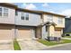 Multi-level townhome featuring attached garage, neutral color scheme, and inviting entrance at 4206 Mastic Pt # 24, Acworth, GA 30101