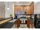 Well-equipped kitchen with granite counters, stainless appliances, and updated cabinets at 4206 Mastic Pt # 24, Acworth, GA 30101