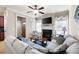 Comfortable living room featuring a fireplace, TV, modern decor, and natural light at 4206 Mastic Pt # 24, Acworth, GA 30101